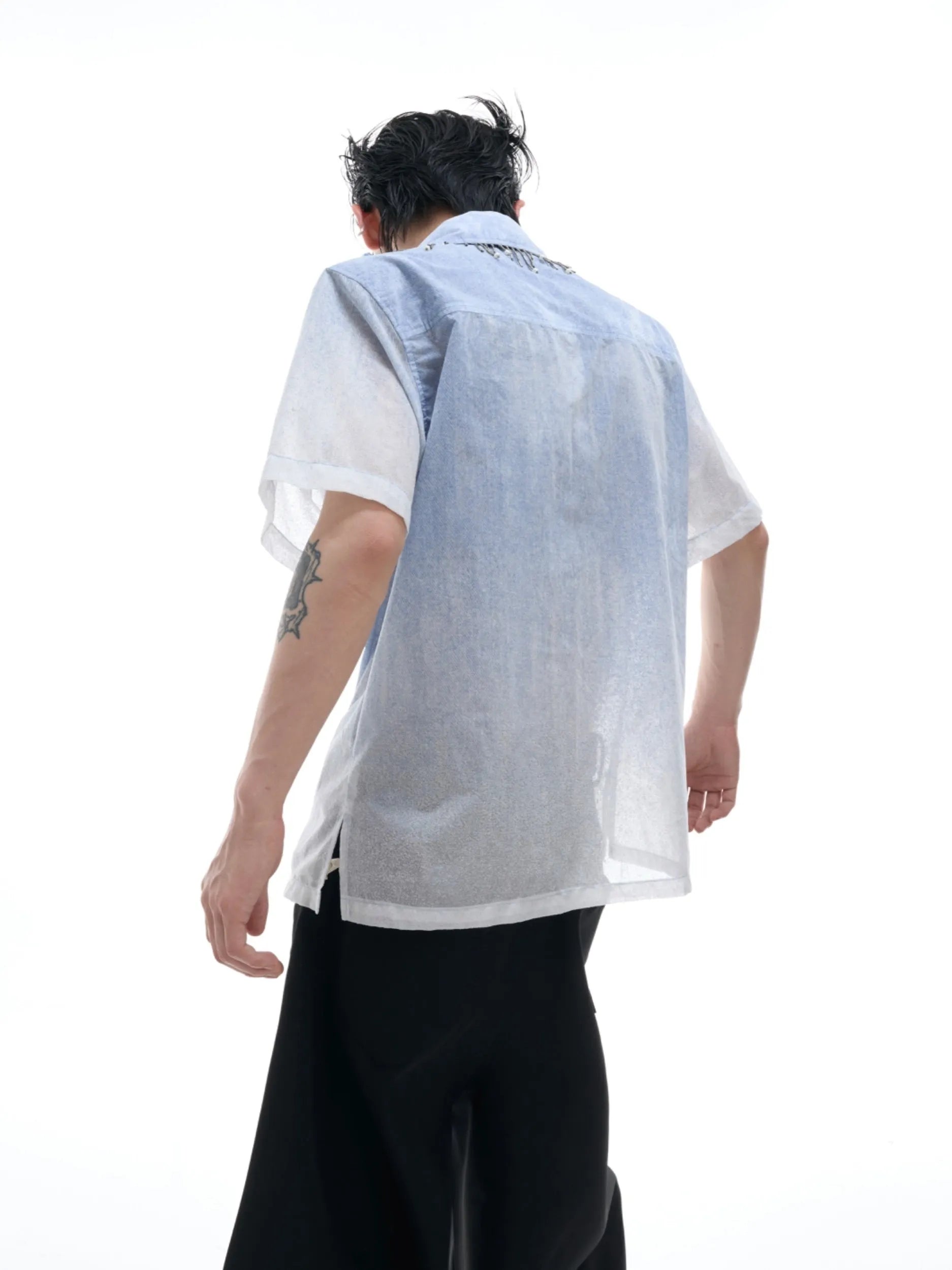 Man's blue and white gradient loose-fitting short sleeve casual shirt on a hanger