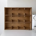 Solid wood multi-layer grid storage rack with birch finish and square compartments for cup organisation