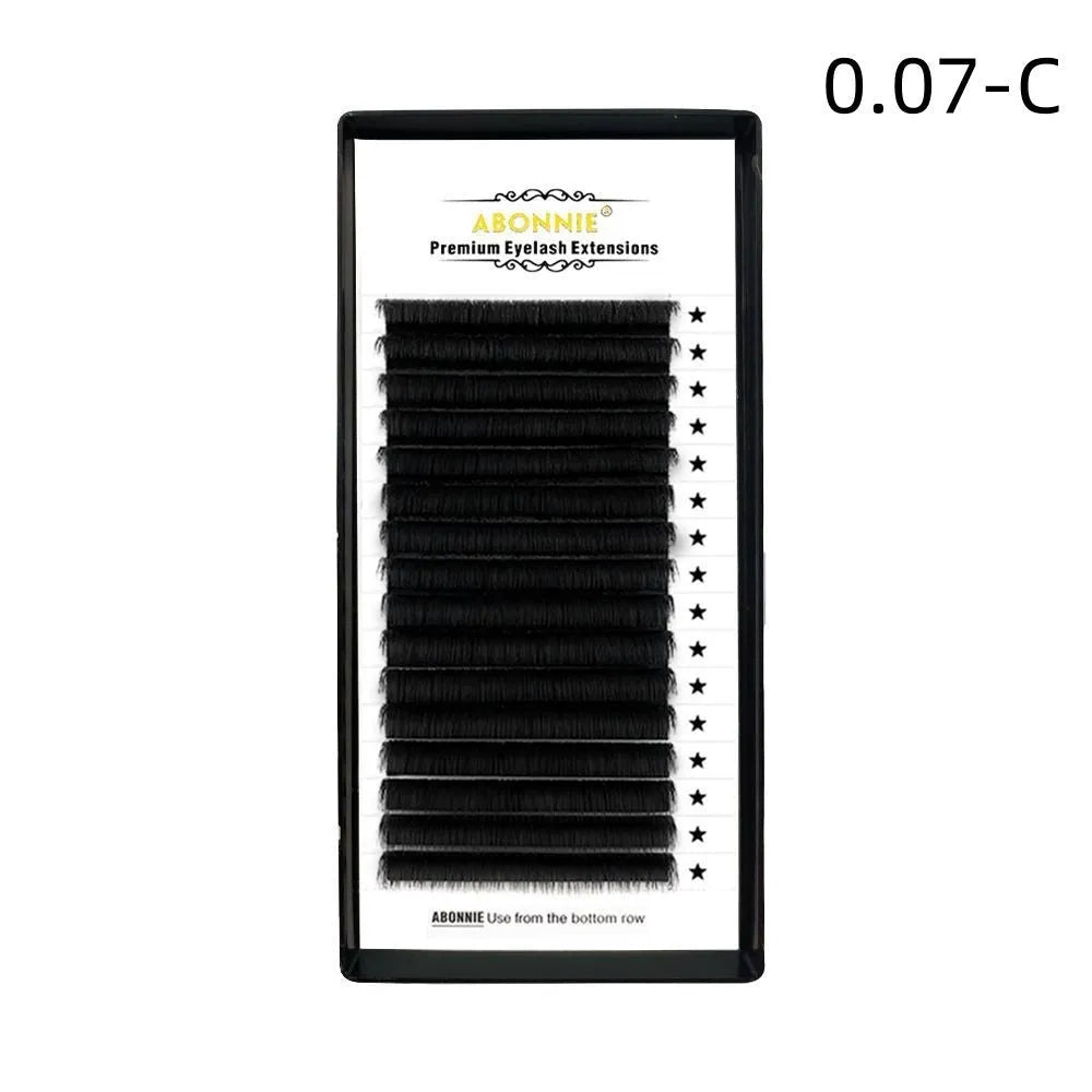 Close-up of 16-row dense false eyelashes made from mink hair on a matte round wool band.