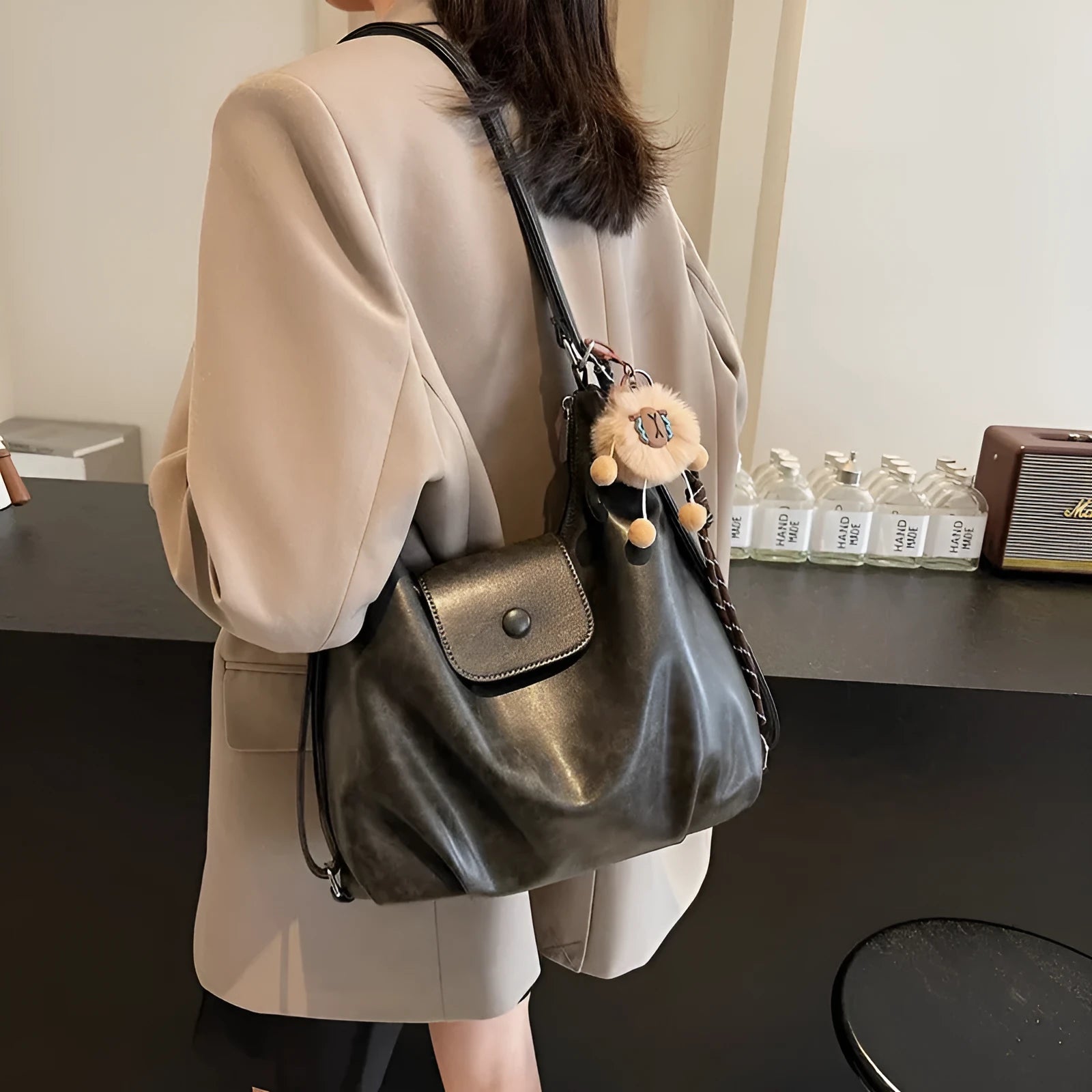Large capacity PU leather single shoulder bag in black with internal mobile phone pocket