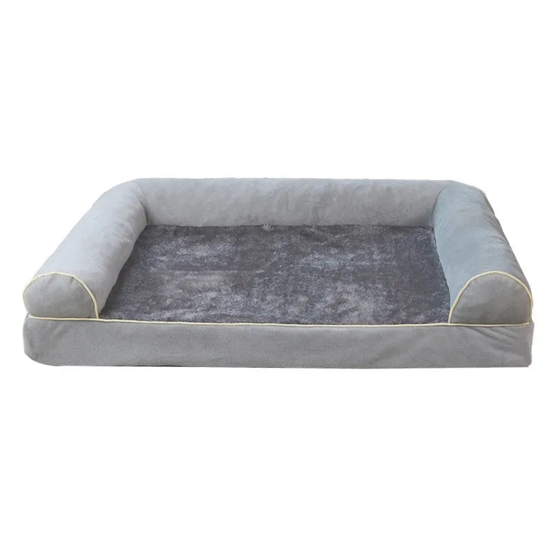 Rectangular grey dog bed with square raised edges and sponge fill for a sleeping dog.