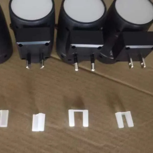 Direct plug induction night lamp with adjustable brightness control and rotatable head in warm white light