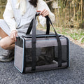A grey portable pet carrier bag with blue edge trim, made from Oxford fabric, shown with dimensions of 44cm long by 29cm wide.