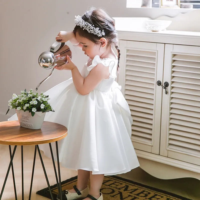 White satin princess dress for girls with puff sleeves, chemical fibre fabric, and flax lining on a white background