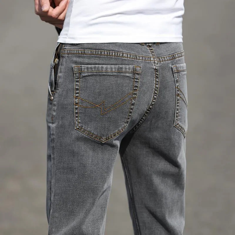 Men's straight leg jeans in smoky grey high elasticity fabric with zip fly closure