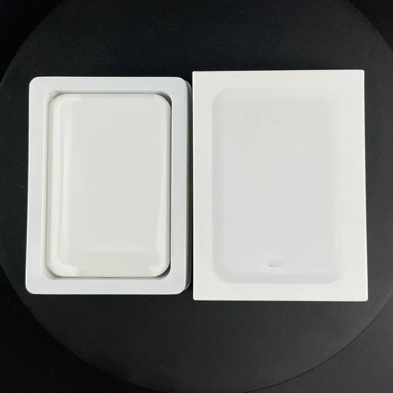 White wireless power bank with magnetic charging surface showing 5000mAh capacity label