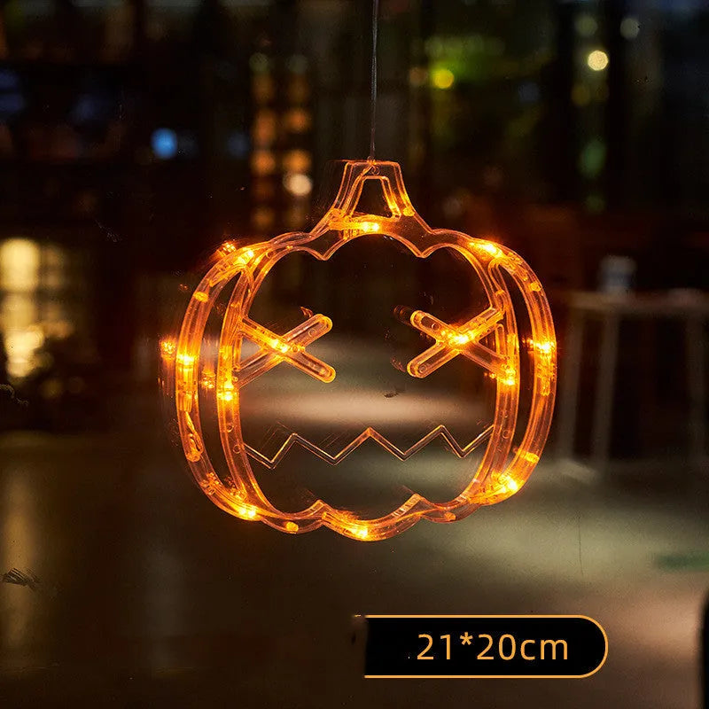 Seven Halloween LED hanging lights with spider, pumpkin and ghost designs featuring suction cups