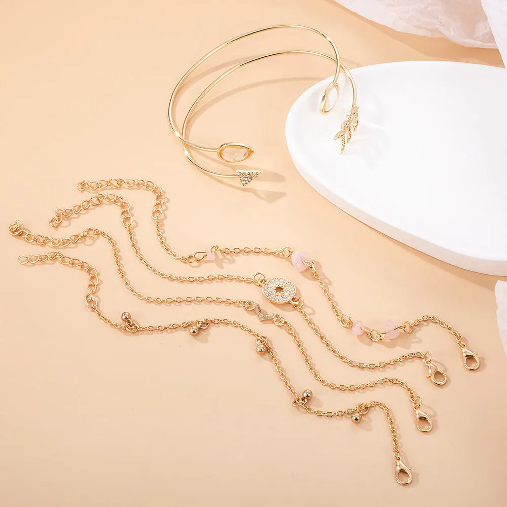 Six-piece women's bracelet set with golden spot drill arrow, water drop and V-shaped charms