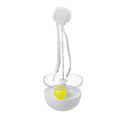White tumbler cat toy with self-congratulating stick on a light floor