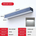 Black solar-powered outdoor wall lamp with integrated solar panel and LED light.