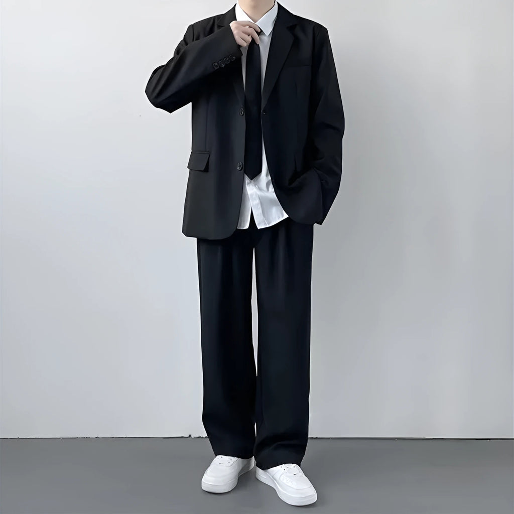 Plus size men's college style suit set featuring a jacket, trousers, white shirt and tie on a hanger.