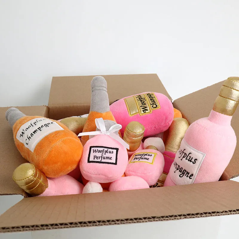 Plush wine bottle dog toy in green with squeaker and crinkle material for interactive play