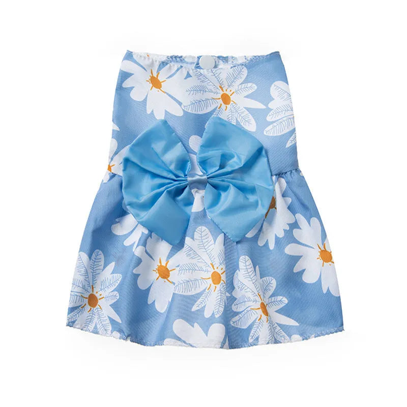 Ultra-thin floral butterfly knot princess dress for a dog or cat in summer, shown with a blue bow.
