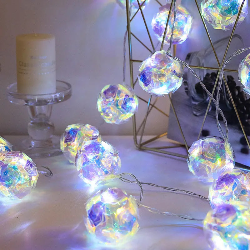 Laser rose windmill LED lamp string with crystal orange light colour on a dark background showing 5cm beads