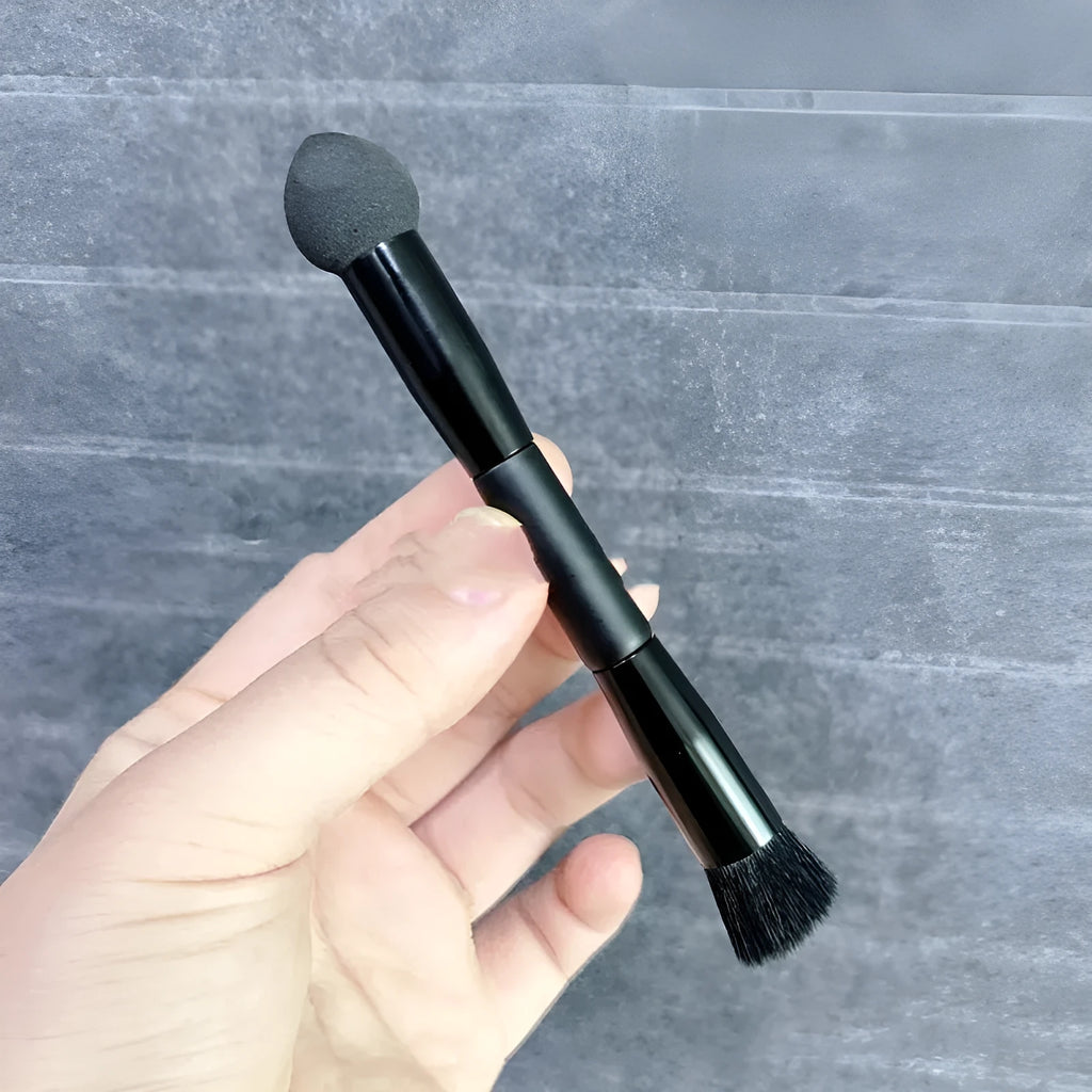 Black wooden-handled concealer brush with a sponge stick applicator tip.