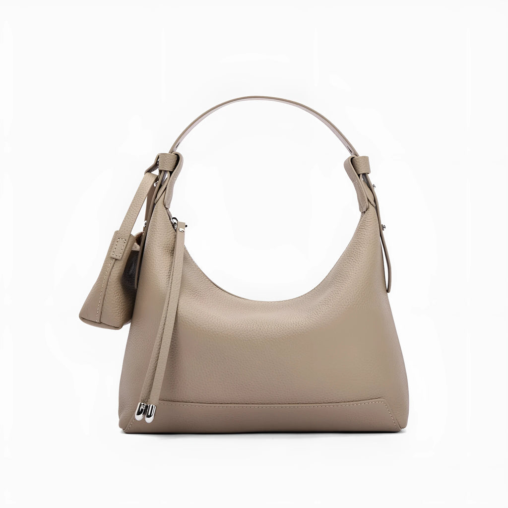 Genuine cowhide leather women's shoulder bag in urban simplicity style, shown in soft construction.