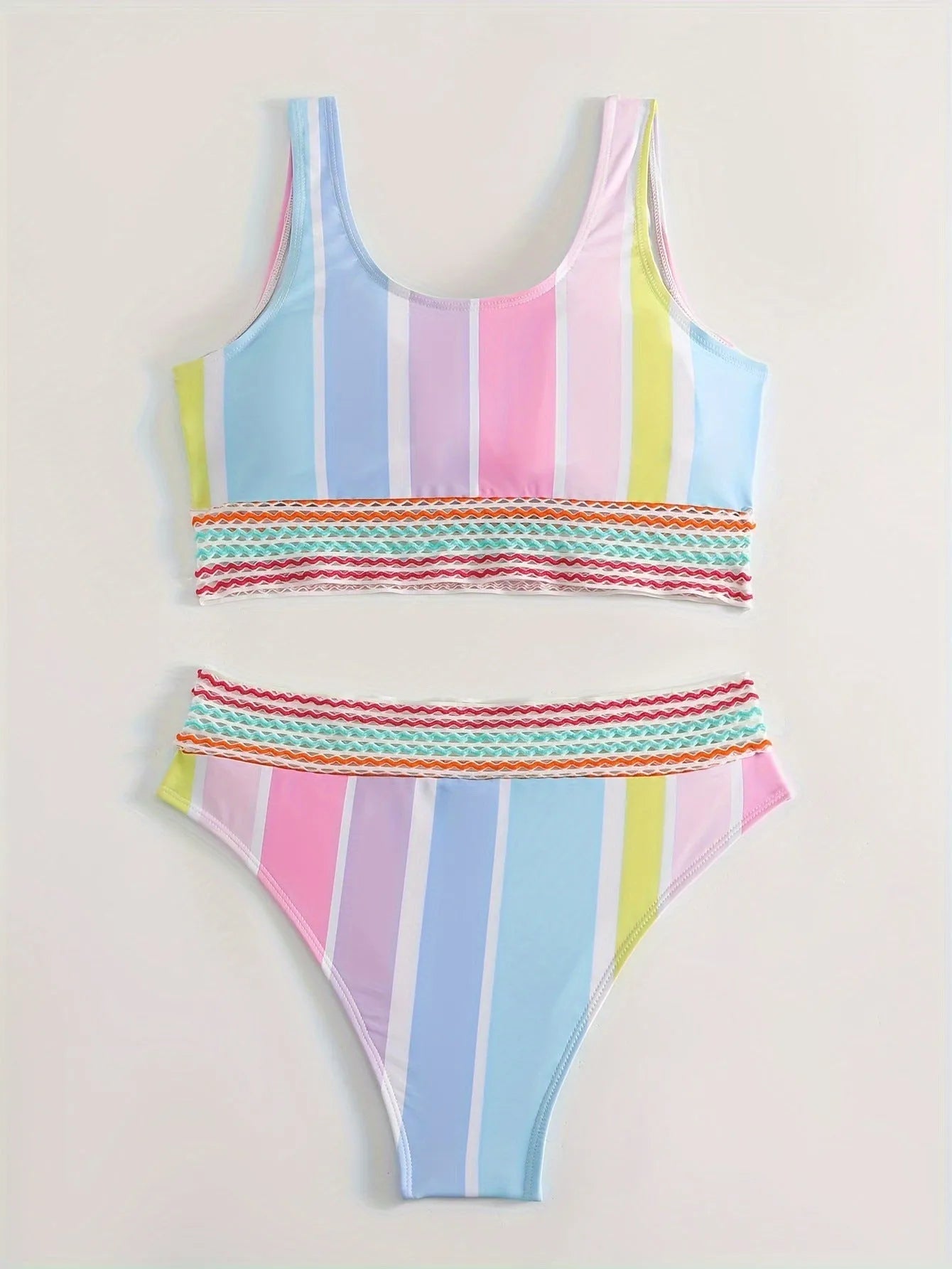 Women's striped bikini top and briefs set on a mannequin, showing the European-American style brief cut and spandex lining.