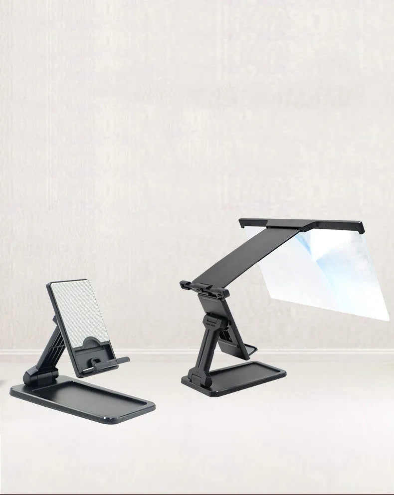 Black folding mobile phone screen magnifier with detachable holder next to an iPhone.