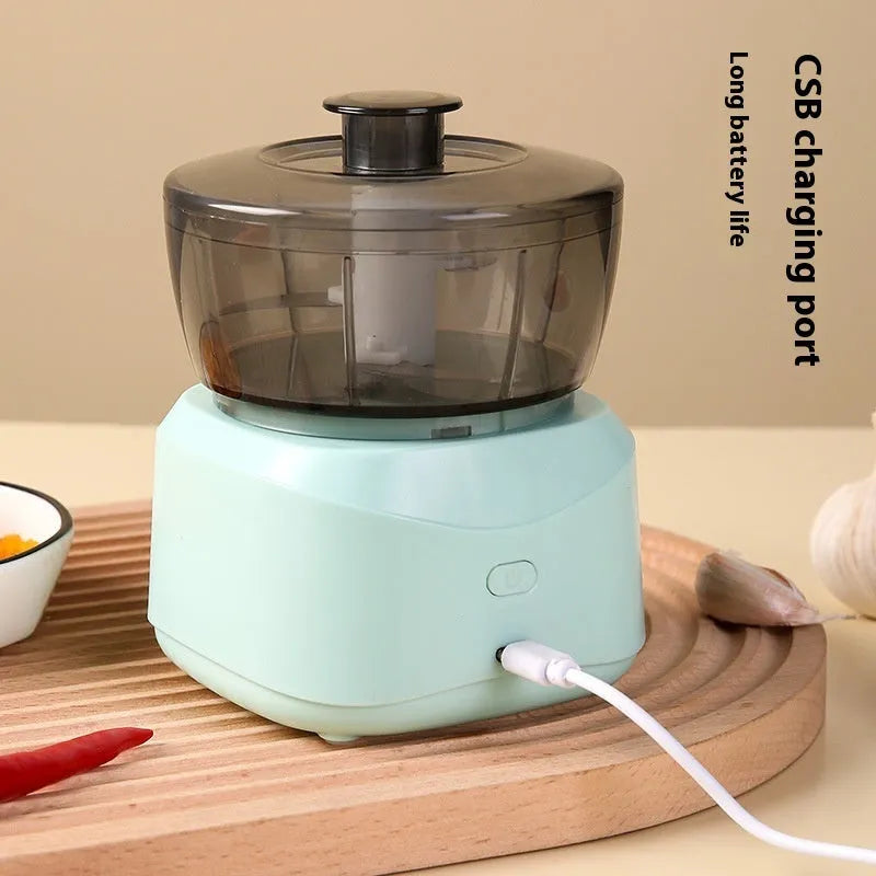 Light blue compact wireless food processor with bowl and blade, 1L capacity, quiet motor