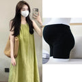 Plus size women's sleeveless asymmetric cotton vest skirt in green with black pants option on model
