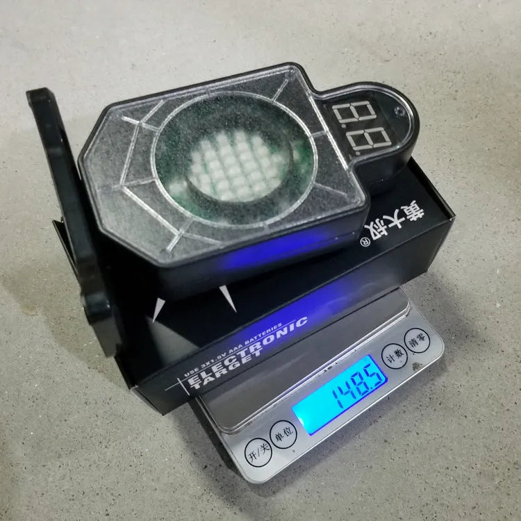 Laser target with light and sound effects in plastic casing, dimensions 9cm by 4.7cm by 12.8cm