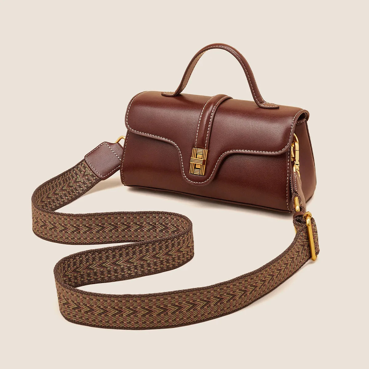 Niche retro Cambridge messenger bag in brown cow leather with lock detail and clamshell opening