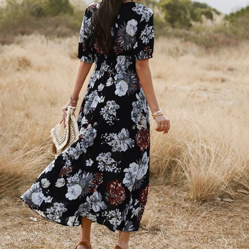 Women's floral summer dress with V neck, short sleeves, elastic waist and large hemline mid-length skirt