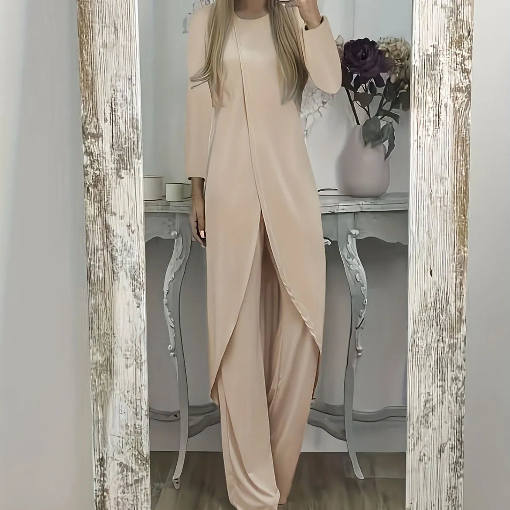 Casual long sleeve two-piece loungewear set in a neutral colour, showing the loose round neck top and matching trousers.