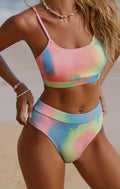 Women's tie-dye pleated split bikini in blue and orange gradient patterns with high elasticity polyester construction