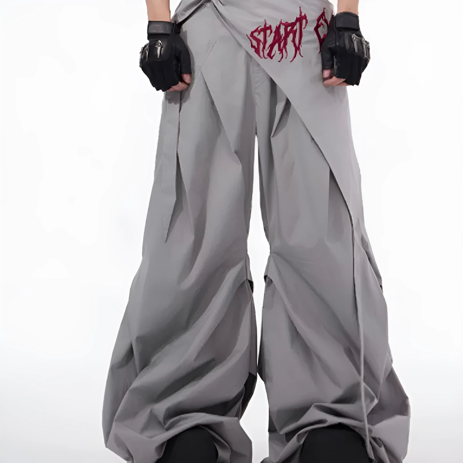 Boy modelling black Korean-style wide-leg summer trousers in a casual setting.