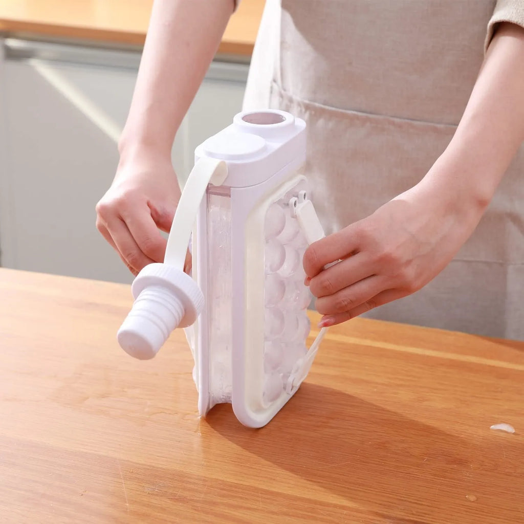Light blue and white portable ice ball mould kettle showing 17-ball capacity and 2-in-1 bottle design