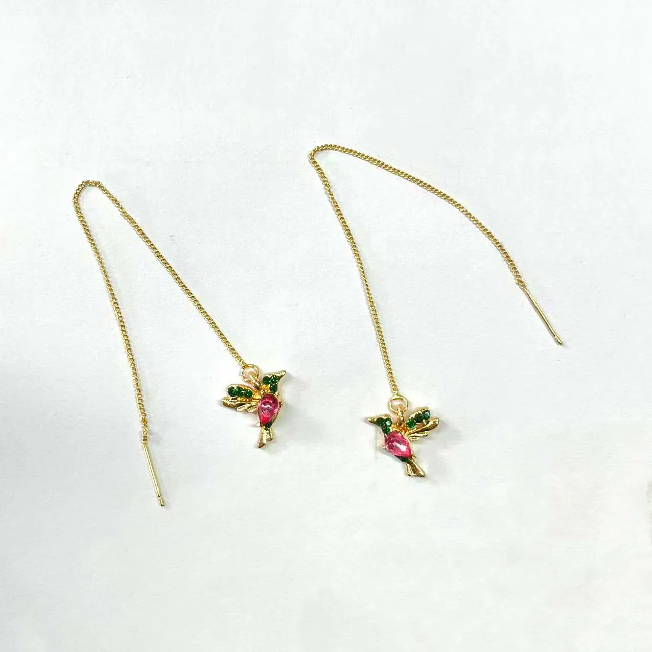 Women's long hanging earrings with bird motif in red, blue, or red lvzuan electroplated alloy.