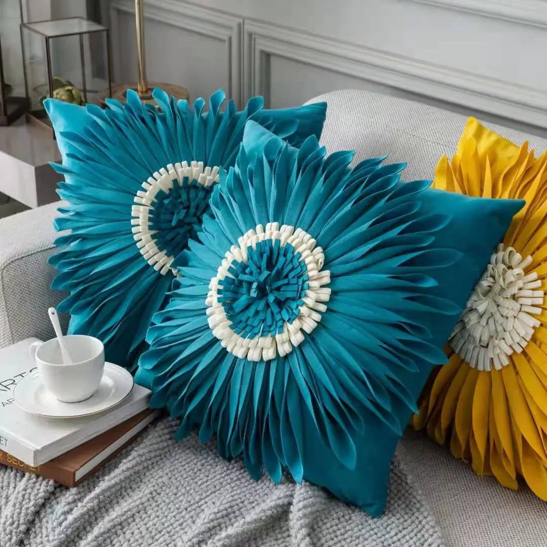White polyester velvet cushion cover with blue chrysanthemum tufting pattern and fringed hem on a sofa