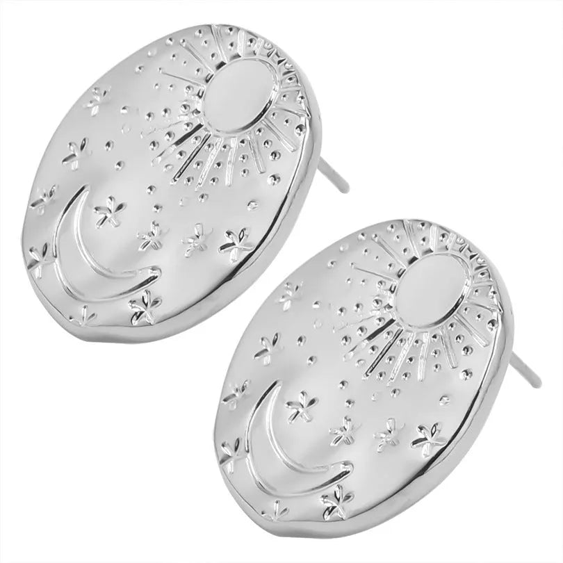 A pair of geometric 304 stainless steel ear studs with shell detailing, shown in a gold electroplated finish.