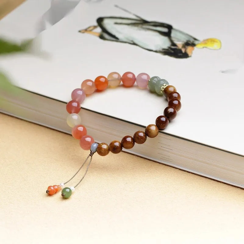 Women's 8mm agate bracelet with diamond-shaped beads and persimmon elements