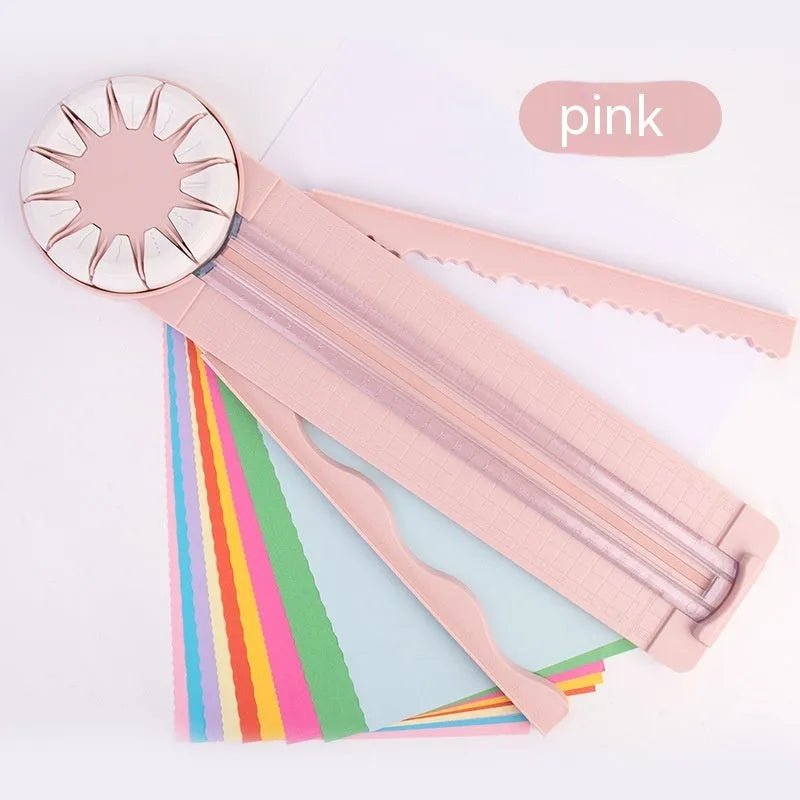 Pink 12-in-1 multifunctional paper cutting machine with dotted guide lines on its base.