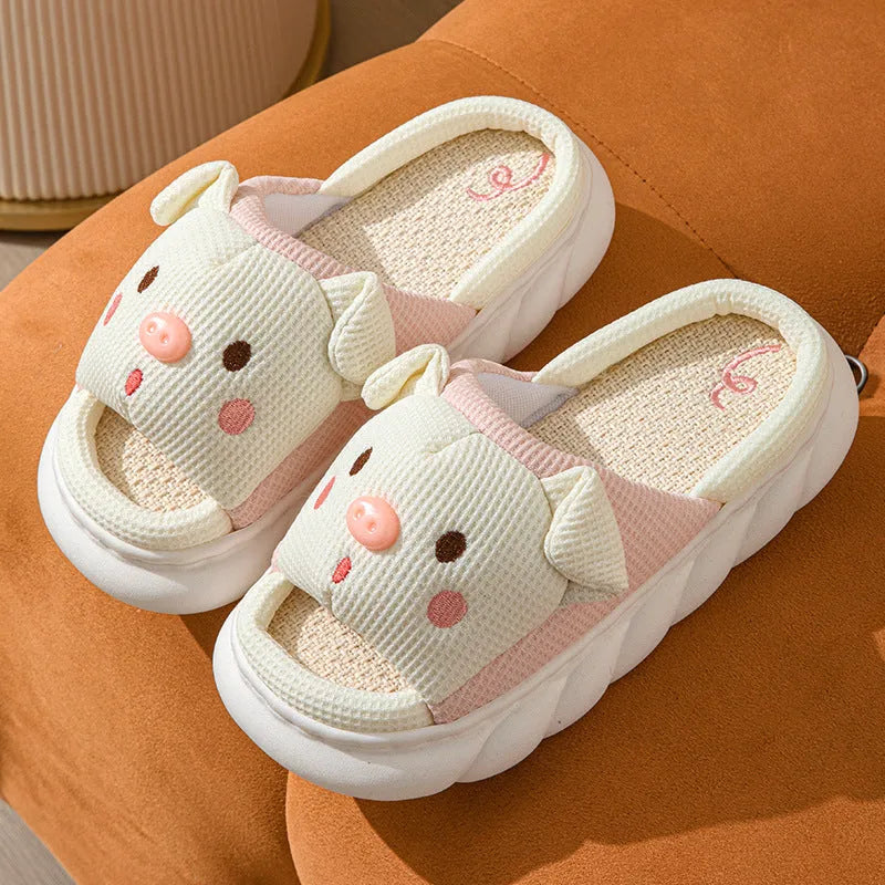 A pair of open-toe linen flip flop slippers for couples, shown in a choice of colours with a cushioned footbed.