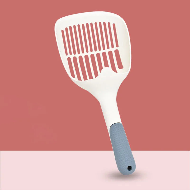 Large white plastic cat litter shovel for scooping clumping tofu cat litter.