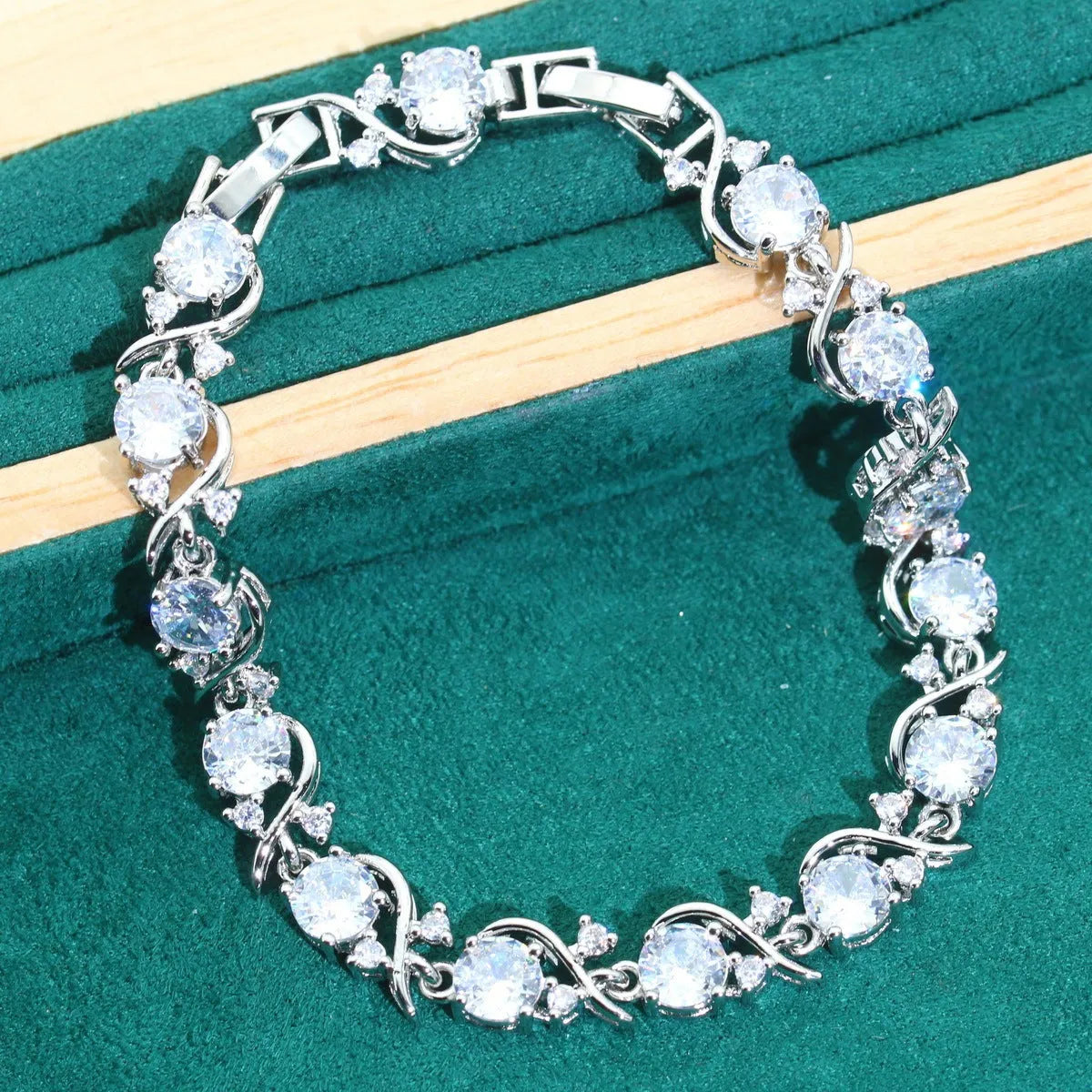 Four-piece bridal jewellery set showing necklace, bracelet, earrings and ring with alloy zircon and water wave chain design
