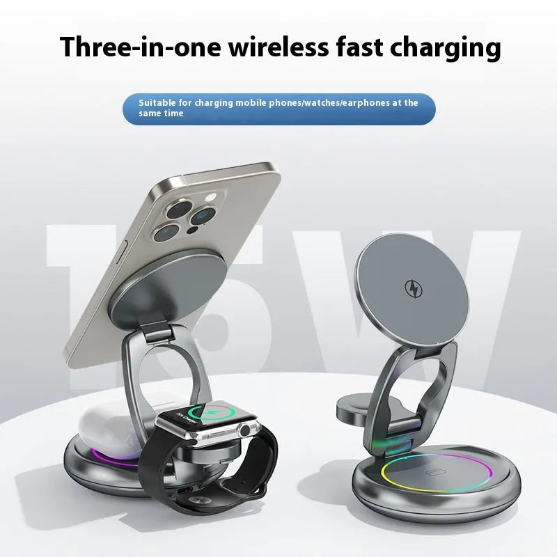 Silver Gray metal 3-in-1 wireless rotatable charger bracket with foldable design on a white desk charging phone, watch, and earbuds
