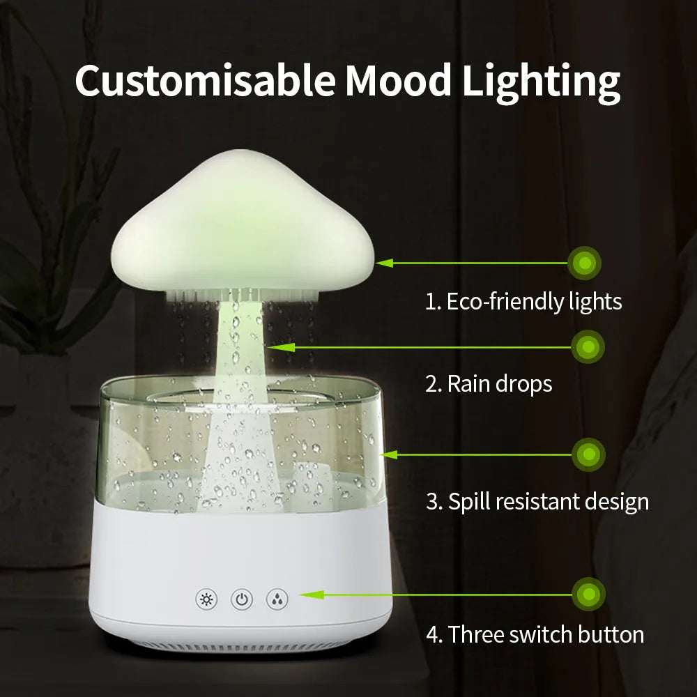 White rain cloud design desk humidifier and aromatherapy diffuser with mushroom-shaped night light on a wooden table.