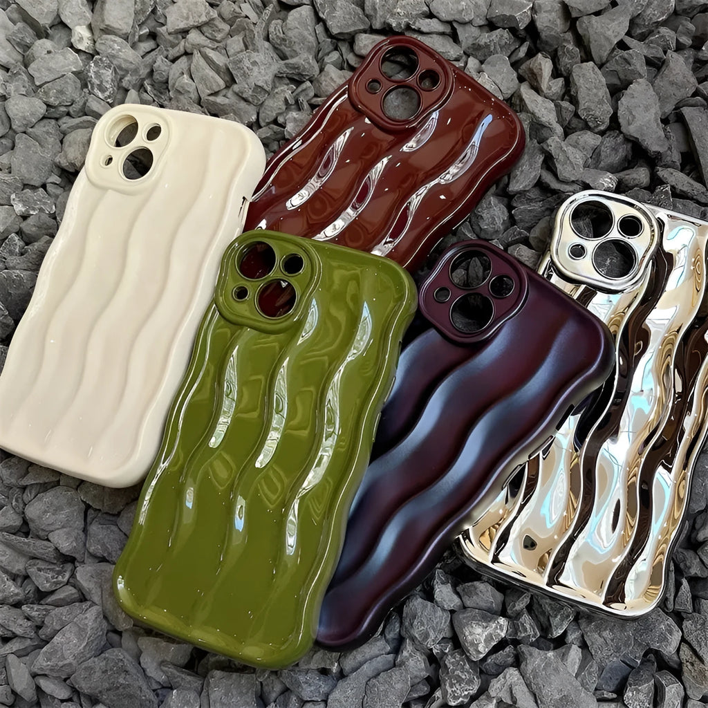 Silicone iPhone 17 case with a textured water ripple surface in green, shown fitted on a phone.