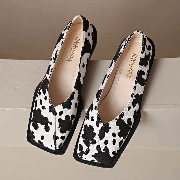 Women's black and white cow pattern flat shoes in first layer cowhide with 6-8cm high heel and rubber sole