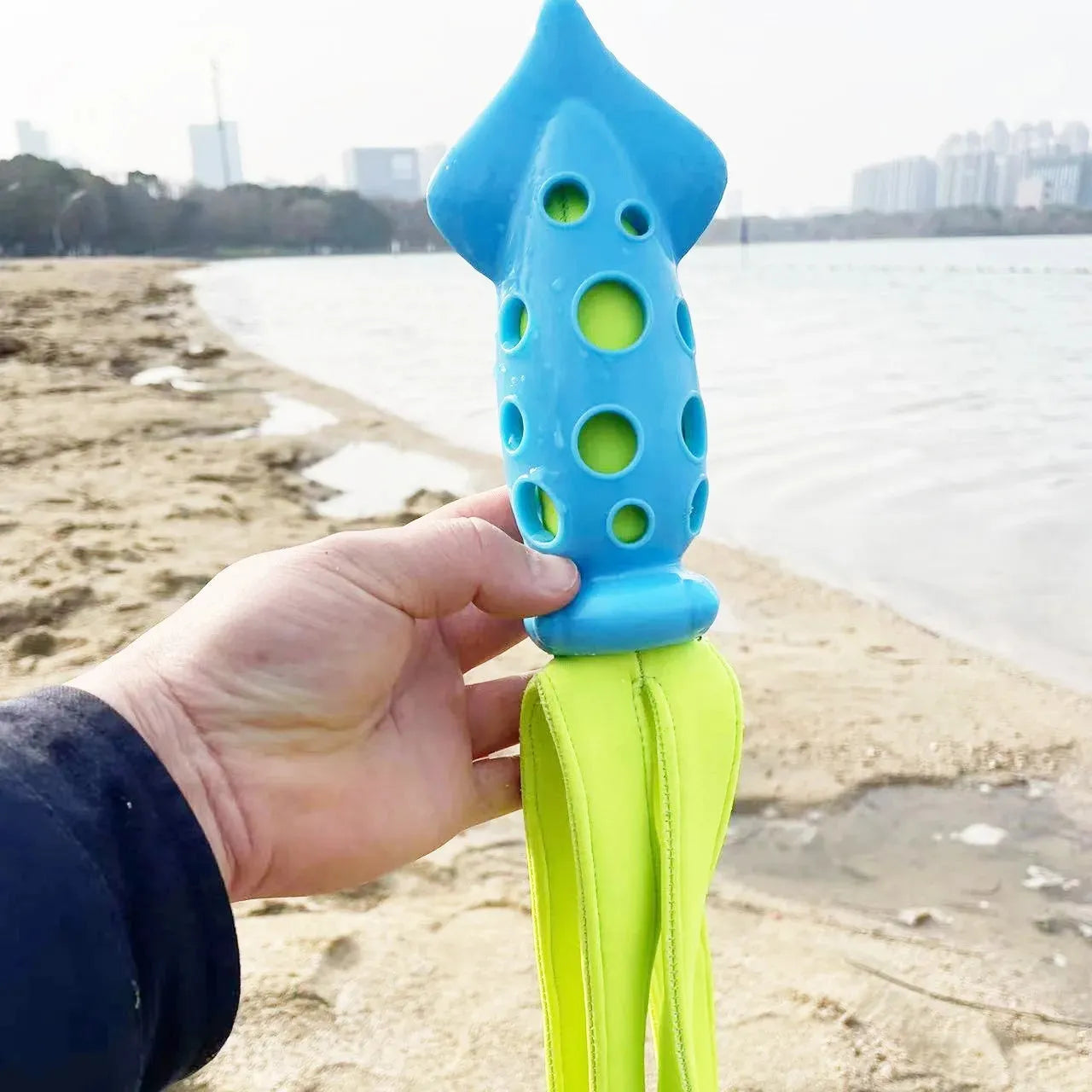 Blue squid-shaped dog chew toy with rubber tentacles and waterproof cloth elements measuring approximately 39cm