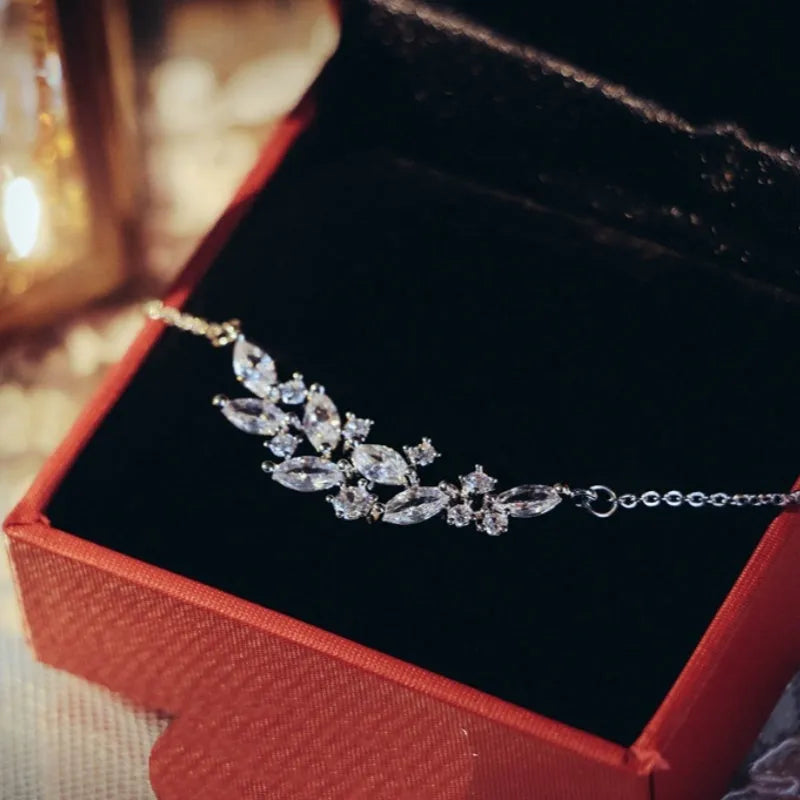 Silver alloy necklace and earrings set with zircon leaf design for bridal weddings