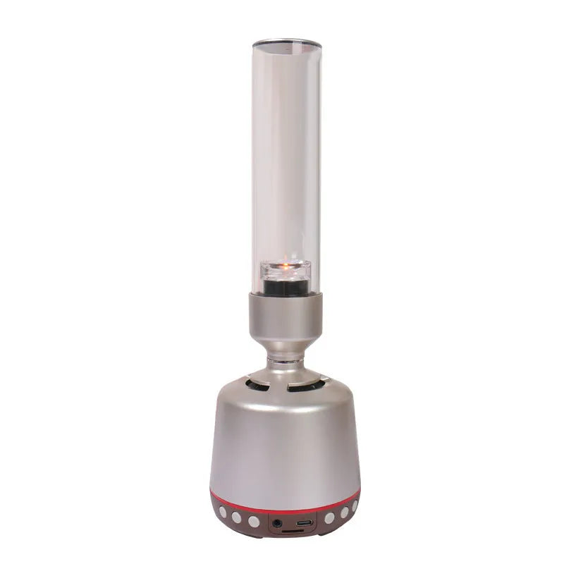 White silver Bluetooth speaker with candlelight night light effect, showing push buttons and compact design.