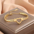 Gold titanium steel personalised love chain necklace and bracelet set with Cuban links and heart shape on white background