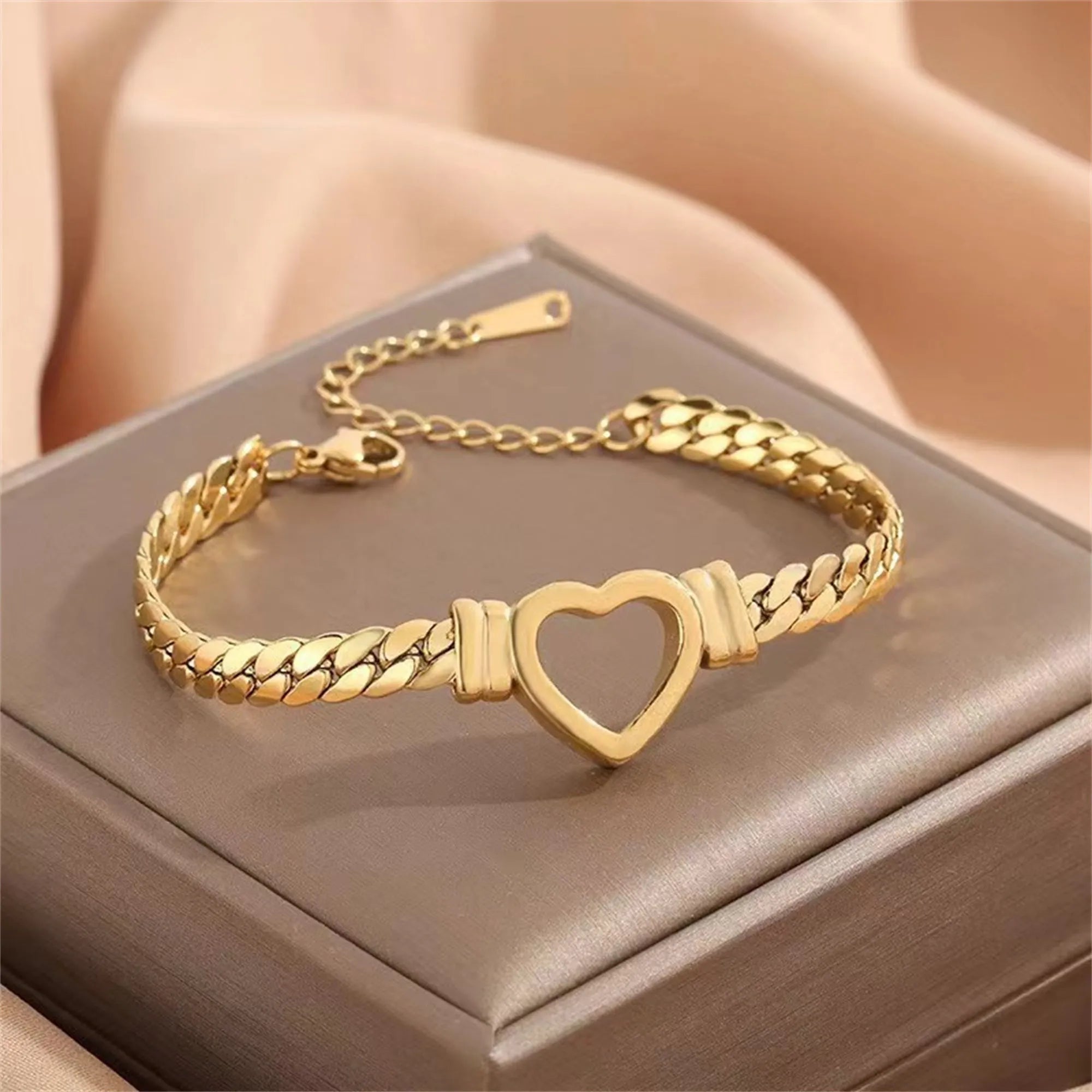 Gold titanium steel personalised love chain necklace and bracelet set with Cuban links and heart shape on white background