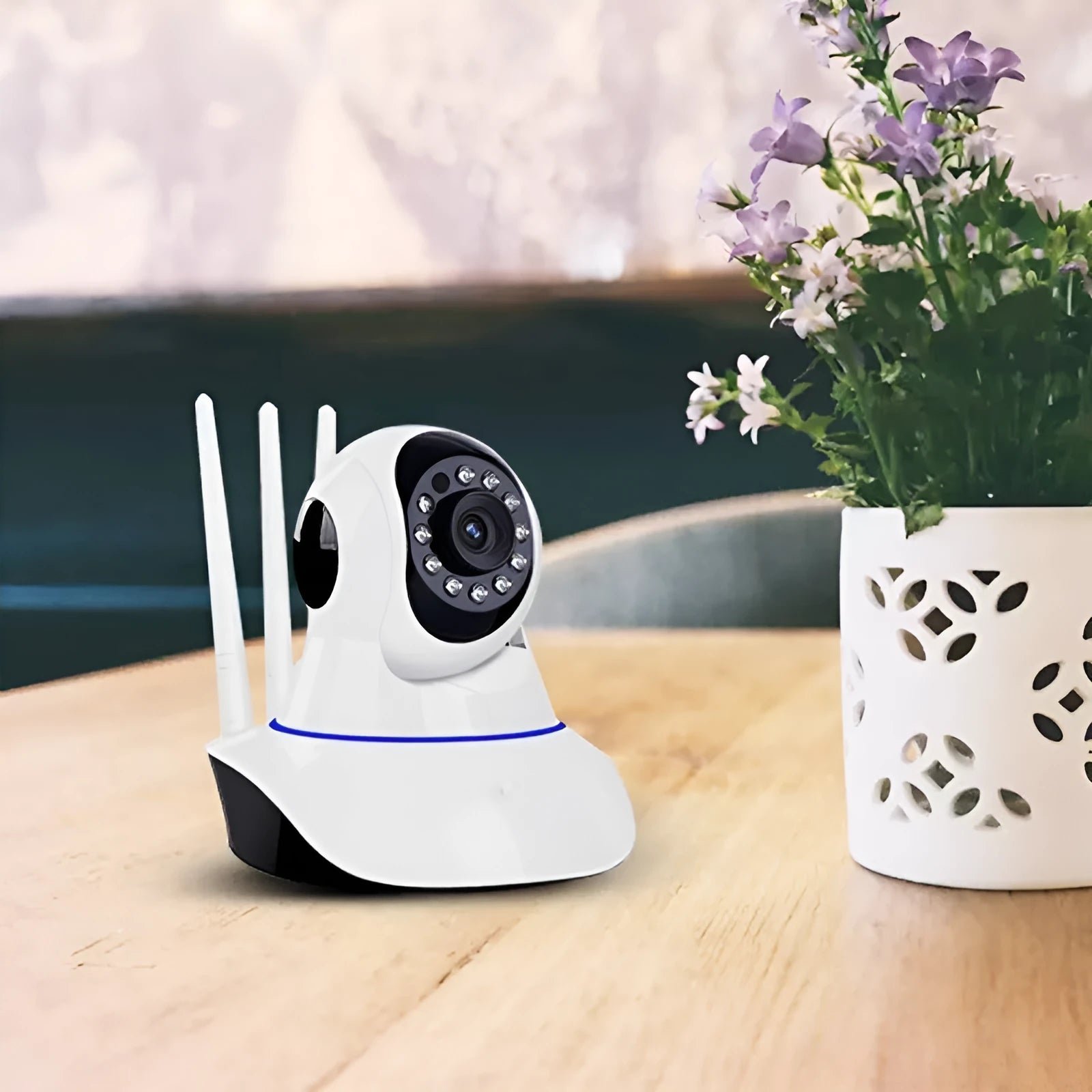 White wireless dome security camera with a 3.6mm lens, shown mounted on a ceiling.