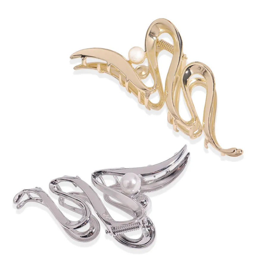 Silver metal hair claw barrette showing one of 45 designs, such as a bow or rose, on a white background.